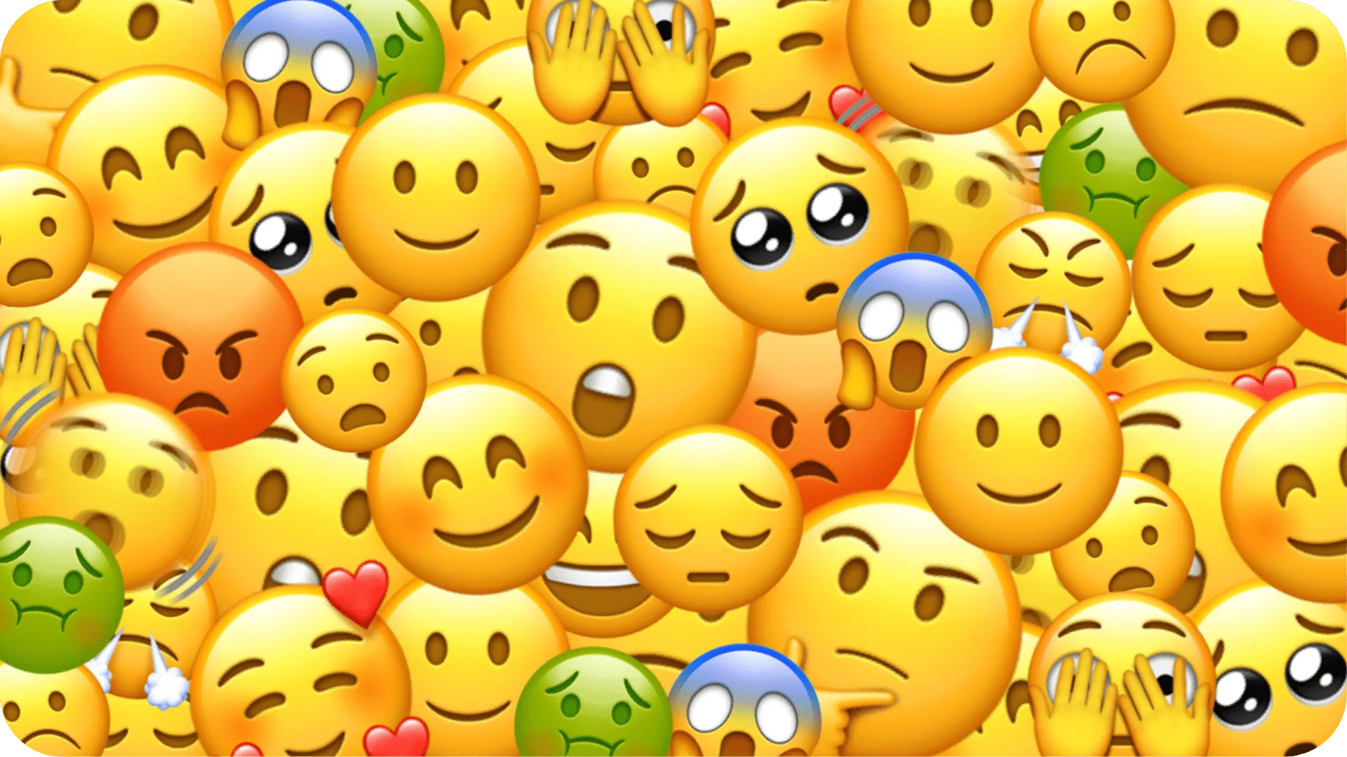 A dense collage of emoji's showing different emotions such as happiness, sadness, disgust, surprise, anger and fear.
