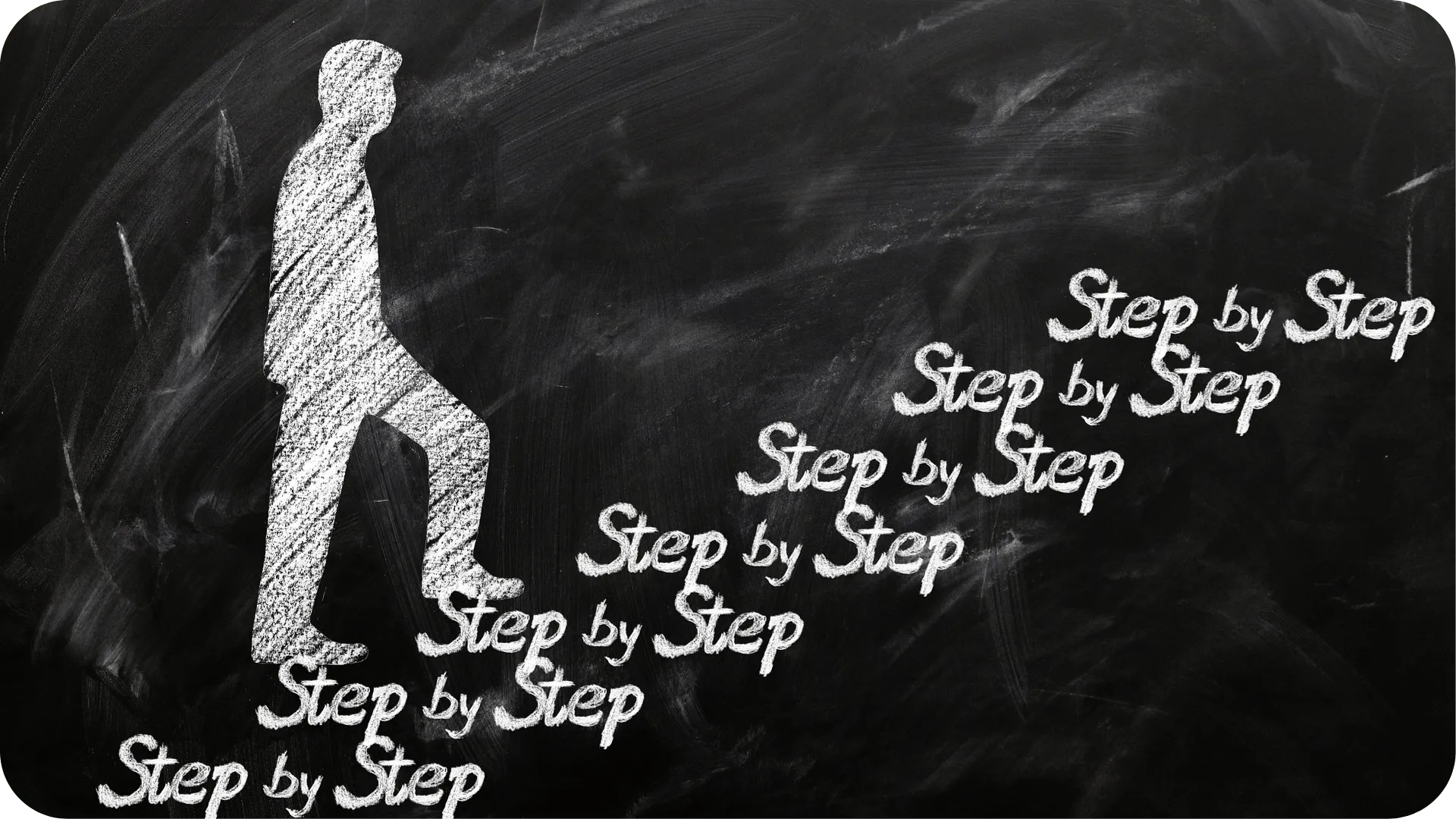 A white chalk drawing of a person walking up some steps out of the words step by step, on a black chalk board.